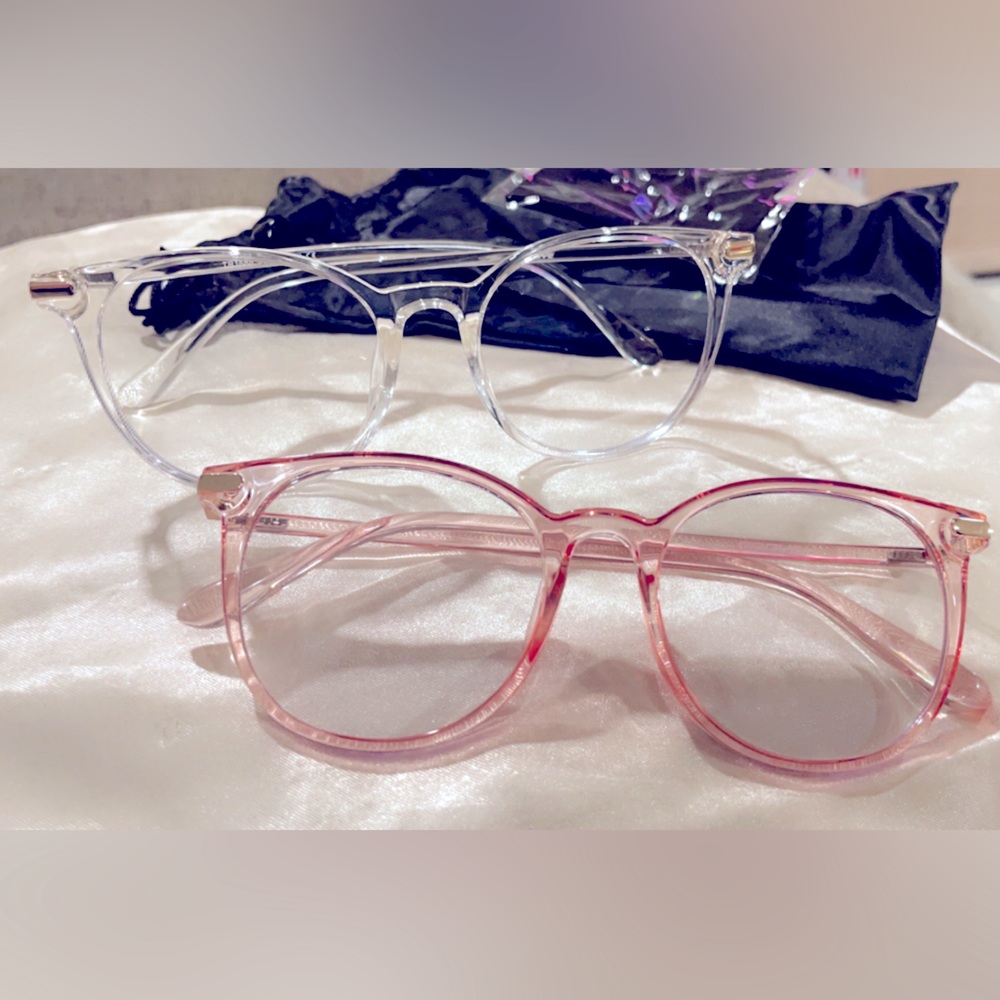 One pair of clear framed blue light glasses with bag